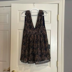 Lulus blue shimmer dress with floral detail. New with tags. Never worn. Size M.